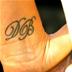 DB (David Beckham) initials tattoo